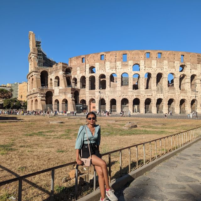 Photo of Pathma Eswaran in front of the Colosseum.